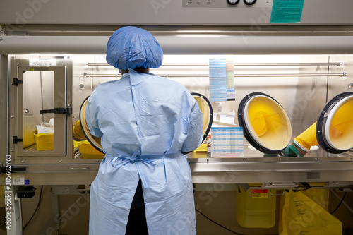 Black healthcare worker handling hazardous drugs for patient at hospital