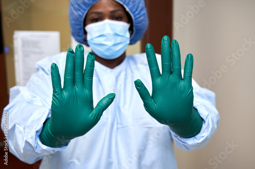 Black healthcare worker wearing PPE safety equipment photo