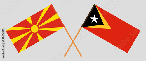 Crossed flags of East Timor and North Macedonia