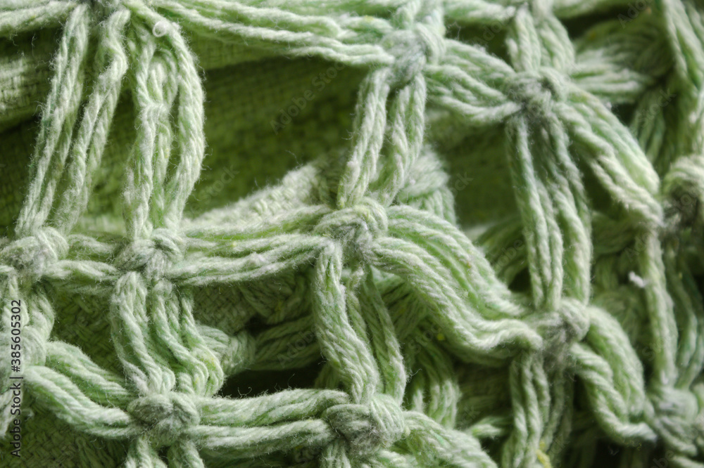 Cordas verdes tramadas formando uma textura