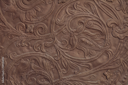 Embossed floral pattern on the gate of an ancient church
