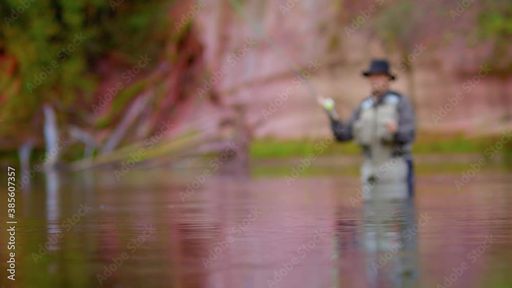 A fully equipped fisherman swinging the fishing line to cast salmon
A man in waterproof clothing and a hat stands in a river and casts his lure with his rod. A fully equipped fisherman swinging the fishing line to cast salmon
A man in waterproof clothing and a hat stands in a river and casts his lure with his rod.