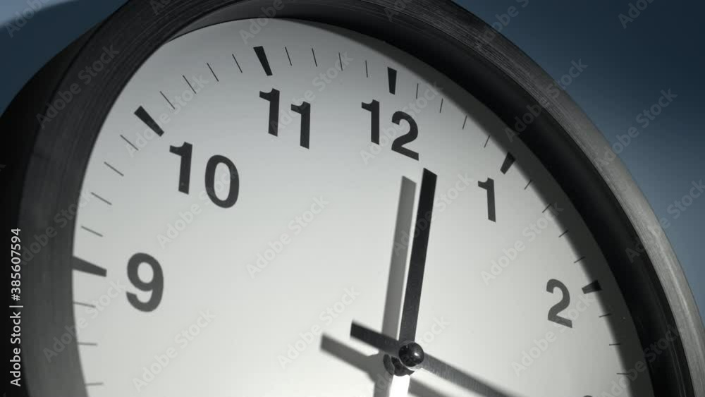 Clock Face in Time Lapse on Light Sky Blue Wall in Office Clock Face in Time Lapse on Light Sky Blue Wall in Office
