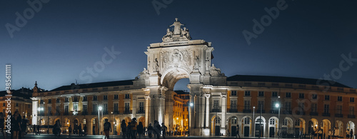 Lisboa, Portugal, Rue Augusta arch in Commerce square at night at Praca do Comercio. sculptures of Viriatus, Vasco da Gama, Pombal, Nuno Alvares Pereira. Wide banner size.