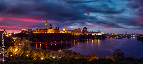 Panoramic view of Downtown Ottawa and the Parliament of Canada. Taken from Nepean Point, Ontario, Canada. Colorful Dramatic Sunset Artistic Render