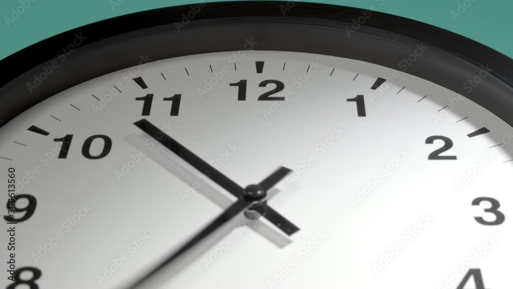 Clock Face in Time Lapse on Cyan Aquamarine Celadon Sea-Green Wall in Office Clock Face in Time Lapse on Cyan Aquamarine Celadon Sea-Green Wall in Office