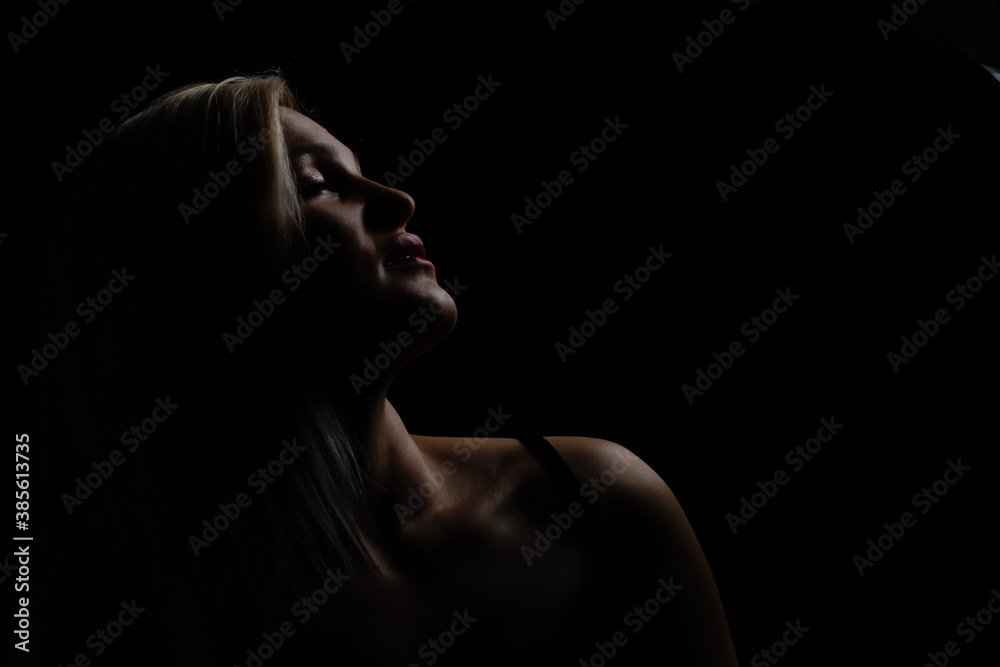 Black and white glamor woman portrait, dark beautiful face, female isolated on black background, stylish sexy look, young lady studio shot Black and white glamor woman portrait, dark beautiful face, female isolated on black background, stylish sexy look, young lady studio shot