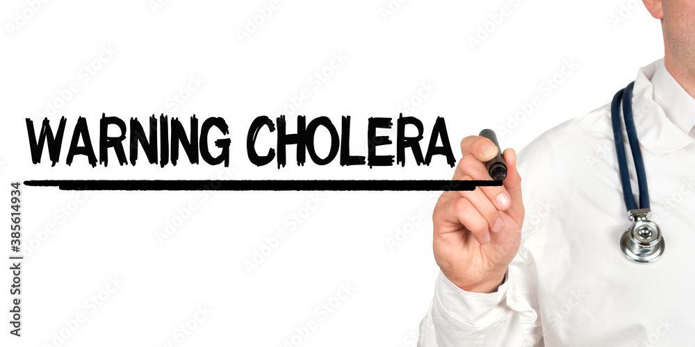 Doctor writes the word - WARNING CHOLERA. Image of a hand holding a marker isolated on a white background.