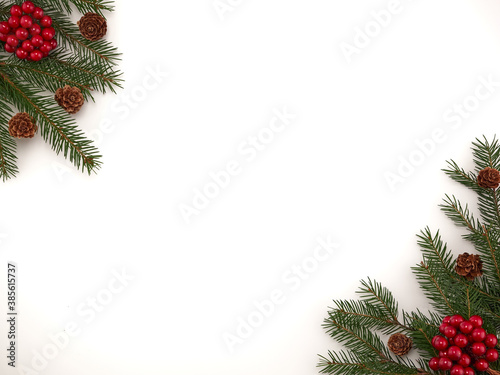 New year Christmas 2021.New year's horizontal background-new year's pine branches lie on a white background, with baubles and sweets.Space for text.