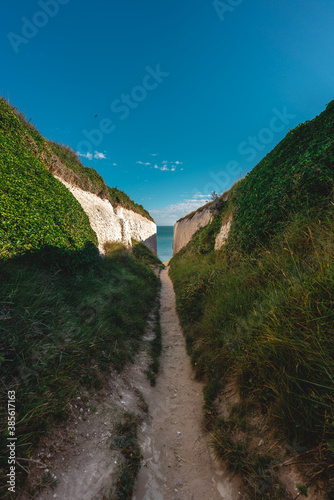Empty Kingsgate Beach, walking through the chalk stacks clifs at Botany Bay in Kent, England. photo