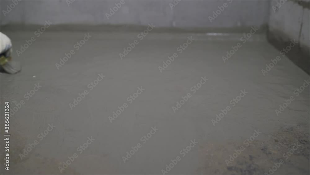 Construction worker with brush applied hydro insulation. Worker waterproofing with a brush. Waterproofing coating. Construction worker with brush applied hydro insulation. Worker waterproofing with a brush. Waterproofing coating.
