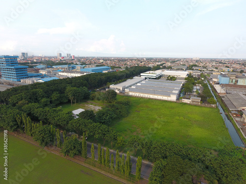 Aerial view of the industrial complex area of Surabaya Industrial Estate Rungkut (SIER) Surabaya, Indonesia, in the middle of a densely populated residential area in the Rungkut area, Surabaya City photo