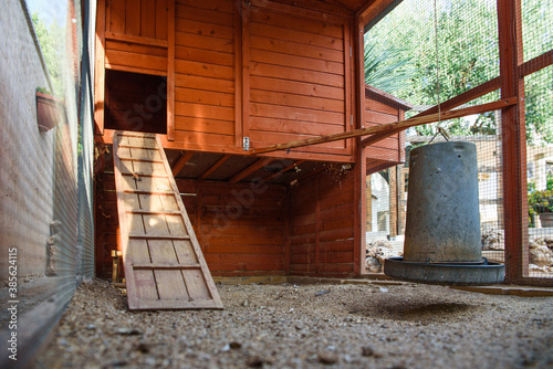 Interior of a dirty empty chicken coop. photo