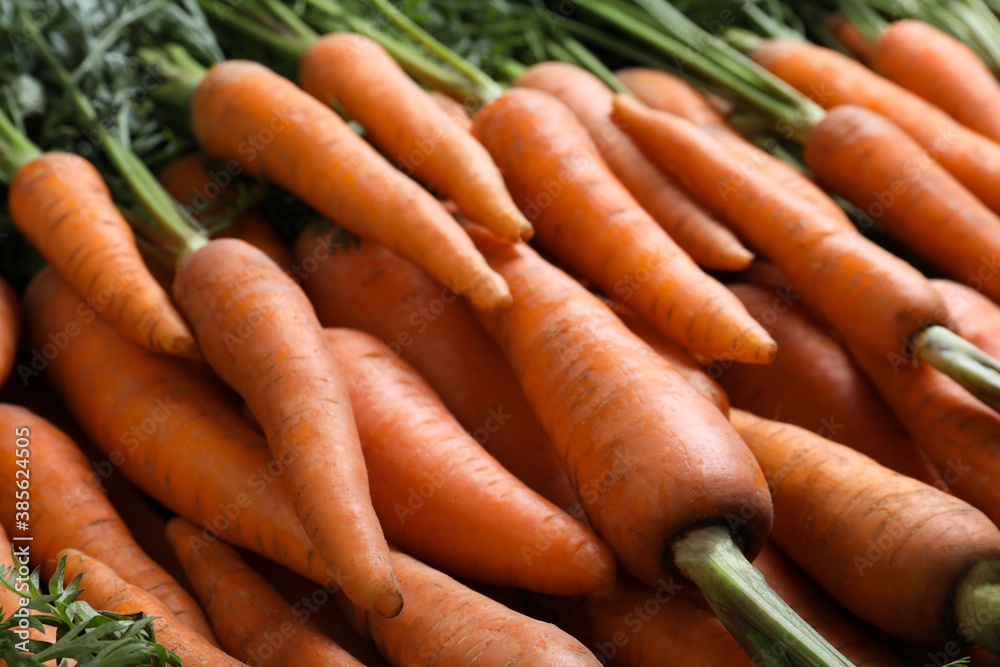 Pile of tasty raw carrots as background, closeup Pile of tasty raw carrots as background, closeup