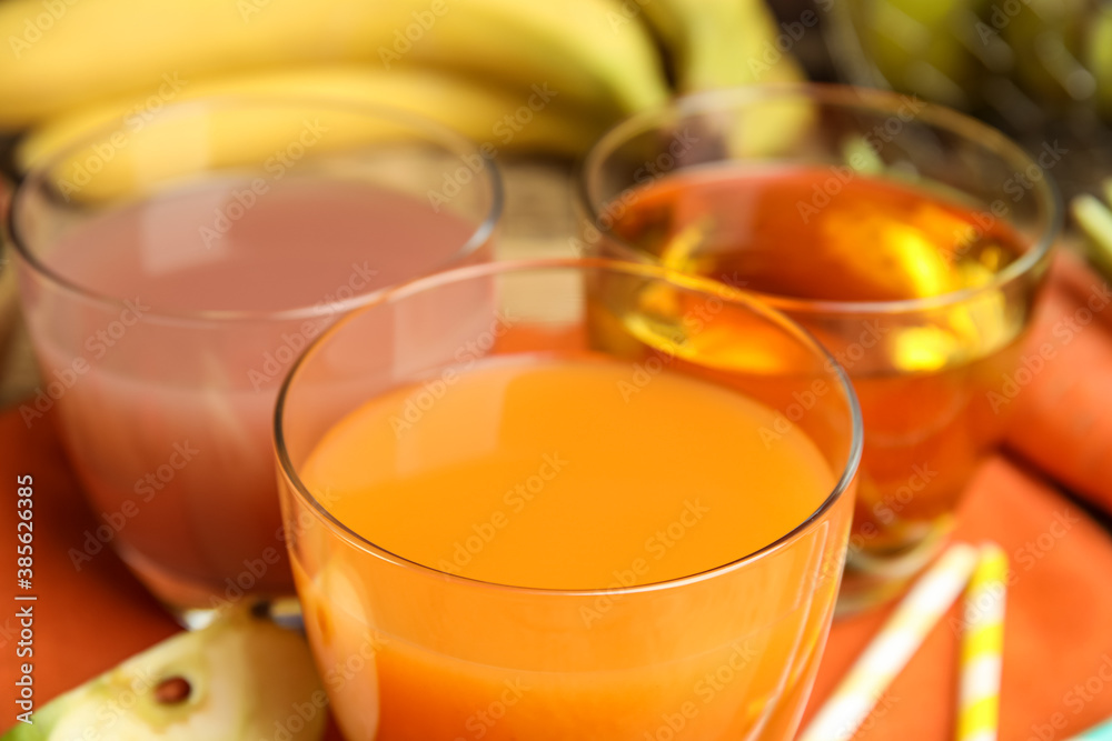 Glasses of different delicious juices, closeup view Glasses of different delicious juices, closeup view