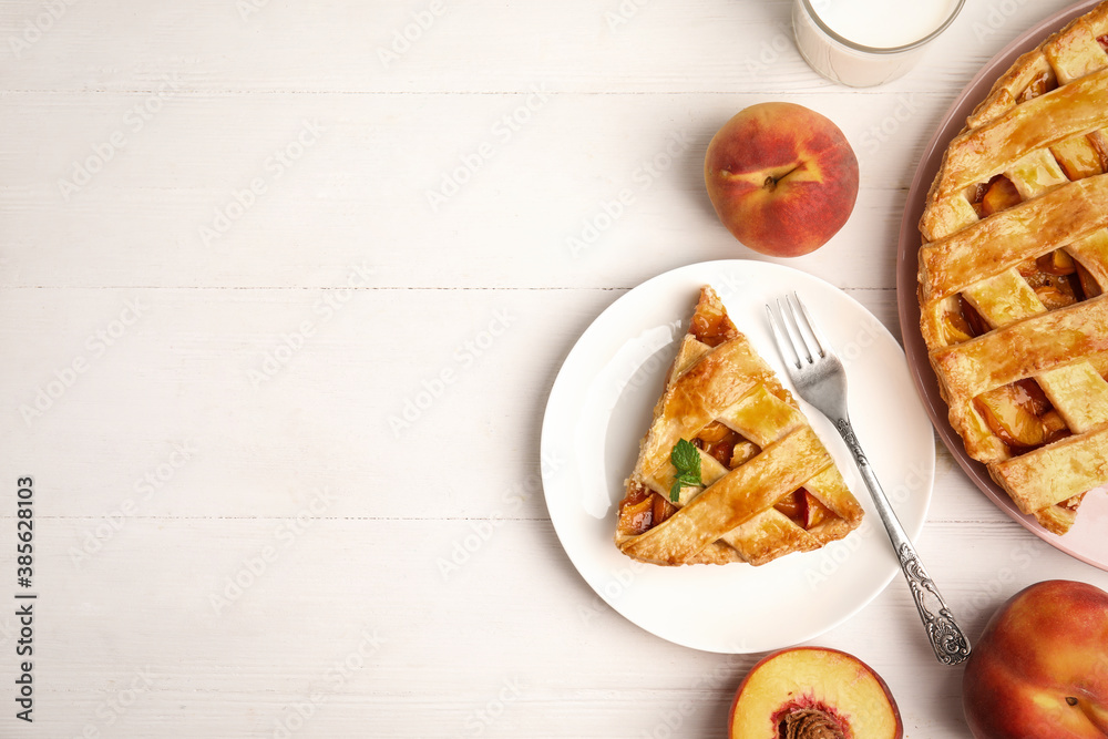 Delicious fresh peach pie served on white wooden table, flat lay. Space for text