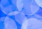abstract blue background with circles.
Abstract blue background with white circles, close-up.