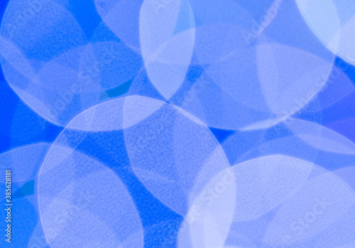 abstract blue background with circles. Abstract blue background with white circles, close-up.