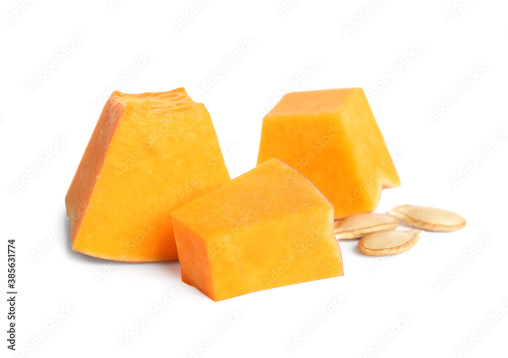 Pieces of ripe orange pumpkin and seeds on white background Pieces of ripe orange pumpkin and seeds on white background