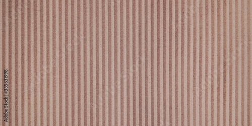 Fototapeta Naklejka Na Ścianę i Meble -  Wall paper design. Brown corrugated sheet of cardboard as background