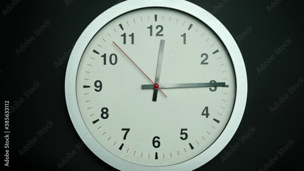 Gray watch isolated on black background, Showtime 12.15 am or pm, Red second hand minute Walk, Time concept. Gray watch isolated on black background, Showtime 12.15 am or pm, Red second hand minute Walk, Time concept.