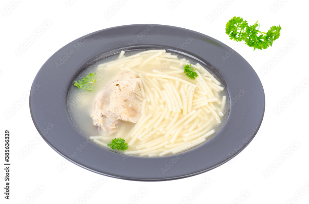 Chicken stock with slice of meat and noodles in black plate. Chicken stock with slice of meat and noodles in black plate.