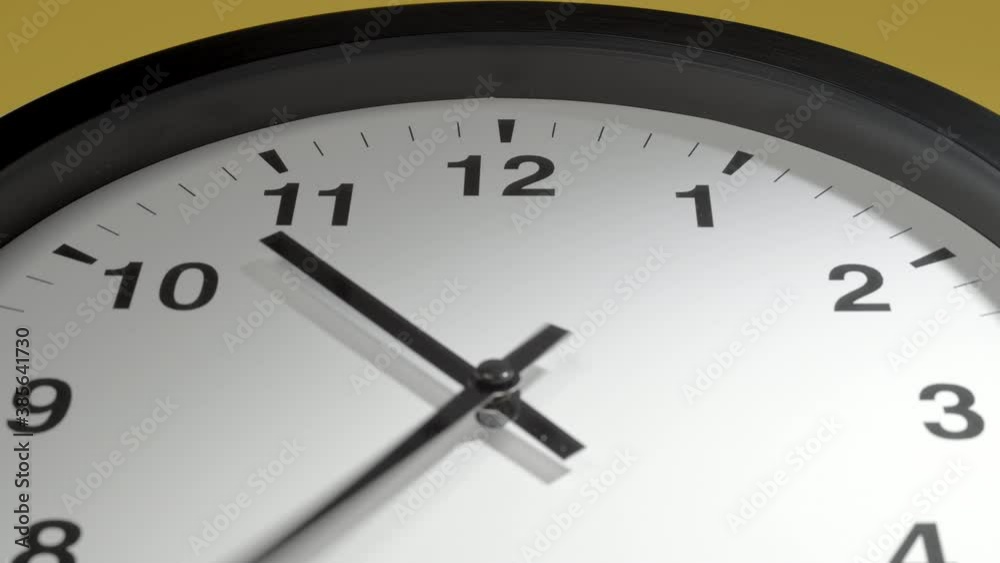 Clock Face in Time Lapse on Yellow Wall in Office Clock Face in Time Lapse on Yellow Wall in Office