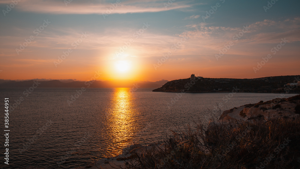 Summer sunset sky over the coast of Cagliari and Calamosca's lighthouse
