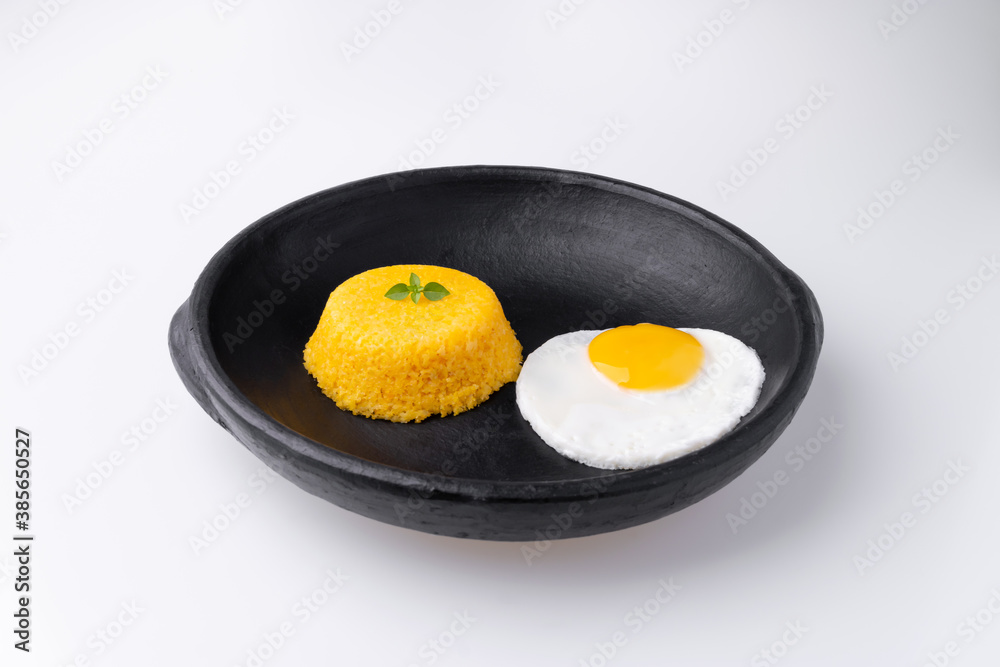 Brazilian Northeast Couscous (Cuscuz Nordestino). Maize couscous on white background