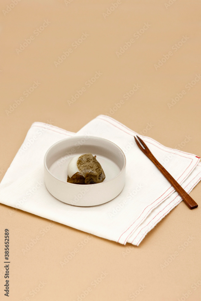Korean traditional rice cake (Manggae Tteok) on brown background. Stock