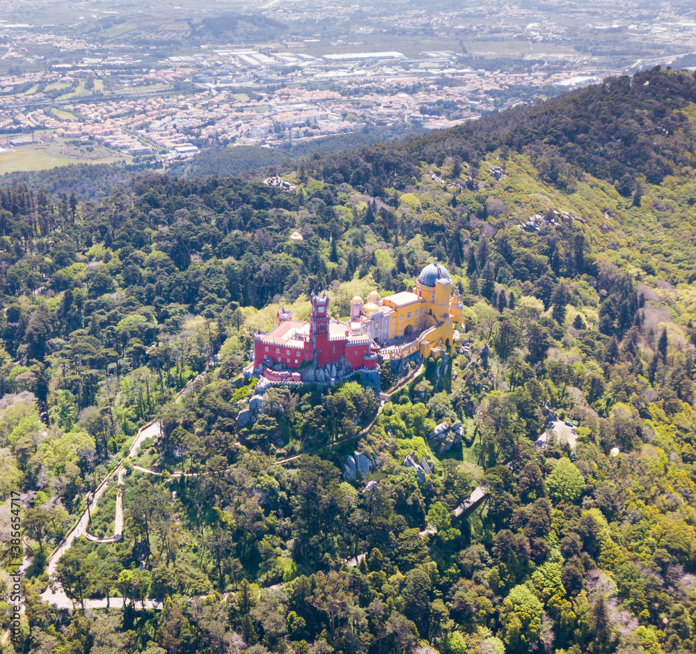 Picturesque Sintra Mountains landscape in sunny spring day with Romanticist castle of Pena Palace, Portugal