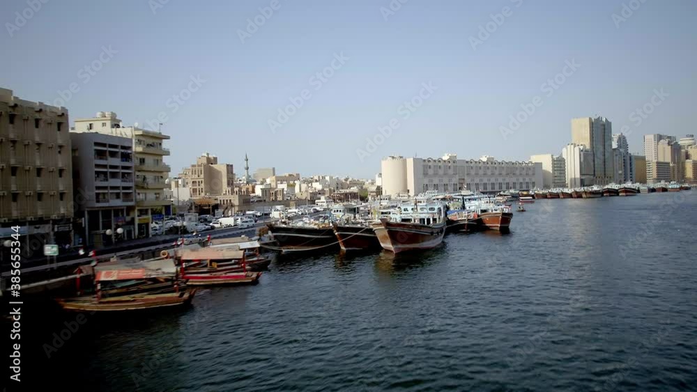 magnificent aerial view of the Deira canal as the camera glides from one sides to another capturing an amazing view of the boat, view the amazing view of the water canal. magnificent aerial view of the Deira canal as the camera glides from one sides to another capturing an amazing view of the boat, view the amazing view of the water canal.