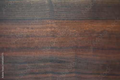 Dark brown wood background texture.
