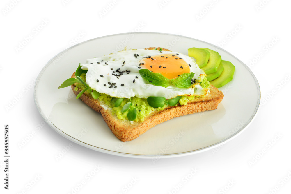 Sandwich with fried egg and avocado on plate against white background Sandwich with fried egg and avocado on plate against white background