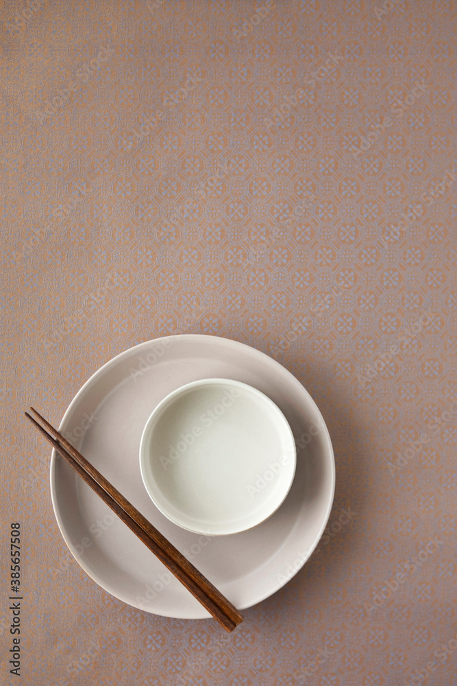 Two circle plate on brown traditional Korean paper (Hanji). Two circle plate on brown traditional Korean paper (Hanji).