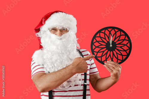 Santa Claus with clock on c...