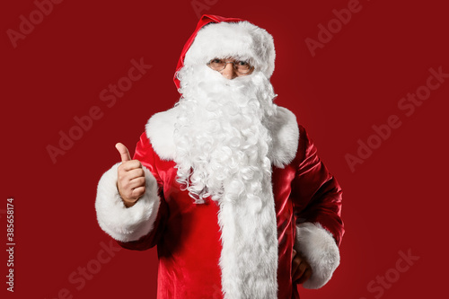 Santa Claus showing thumb-u...