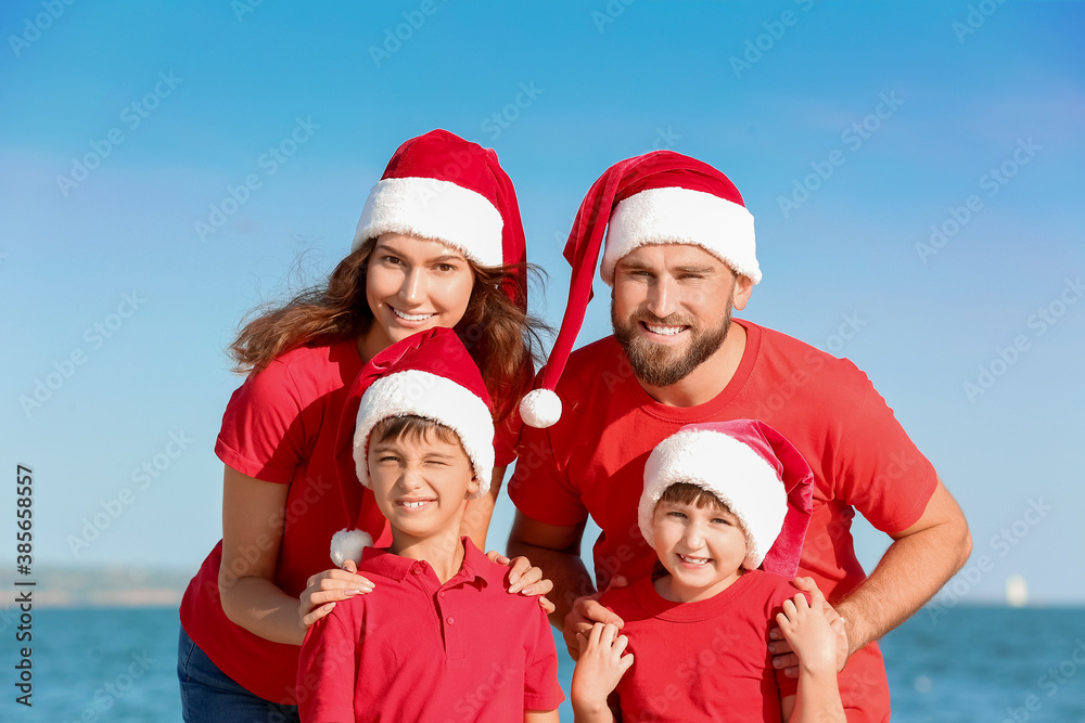 Happy family celebrating Christmas at tropical resort Happy family celebrating Christmas at tropical resort