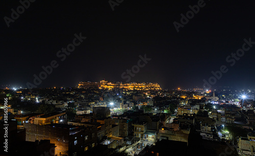  a beautiful view of a jaisalmer city and jaisalmer fort at night
