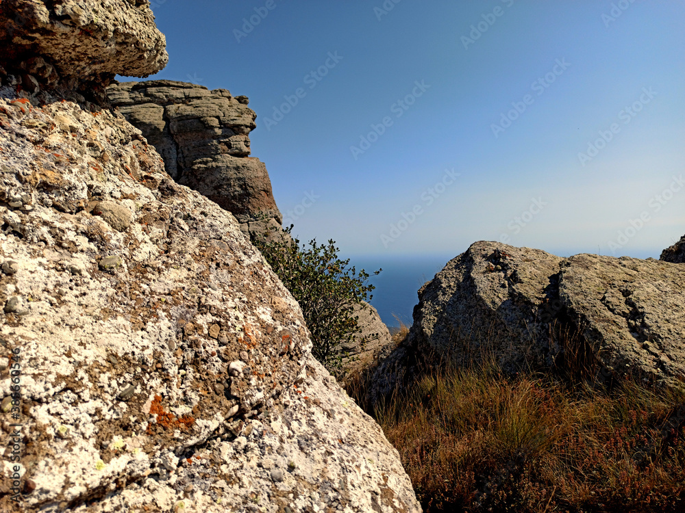 Amazing view on sea and mountains in the distance in hot summer. Vacation, summer travel. Black sea, seacoast. Crimea. Amazing view on sea and mountains in the distance in hot summer. Vacation, summer travel. Black sea, seacoast. Crimea.