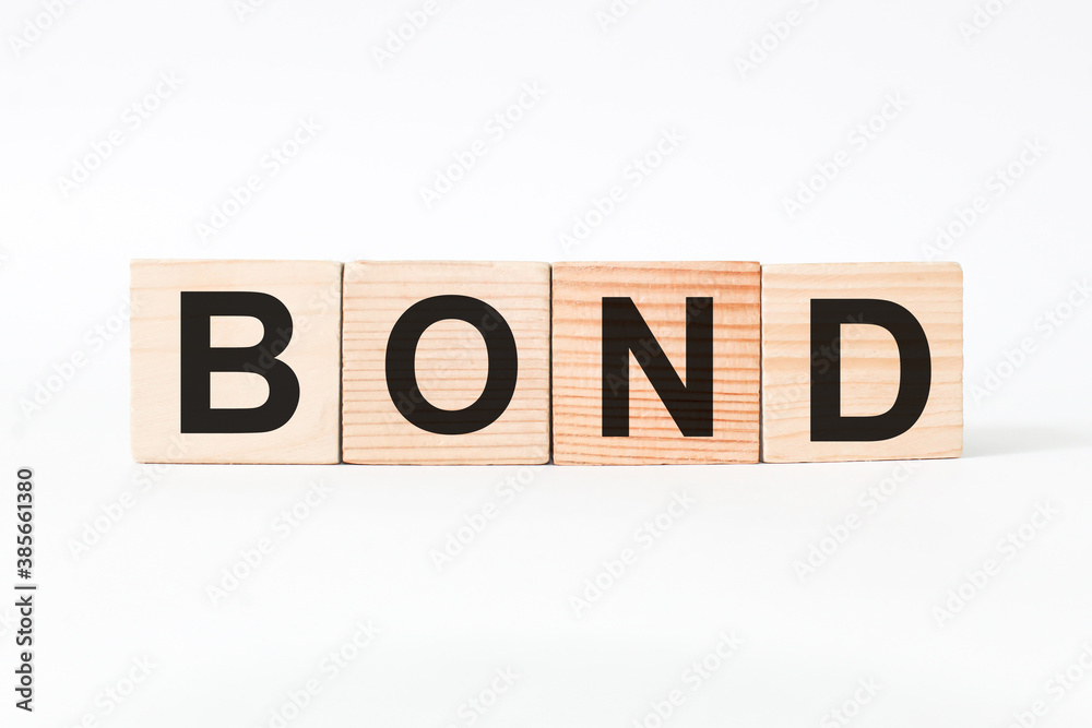 word BOND on wooden blocks, white background, business concept. business and Finance word BOND on wooden blocks, white background, business concept. business and Finance