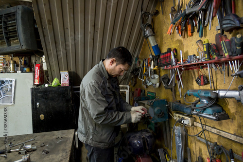 Close-up portrait of locksmith at workplace