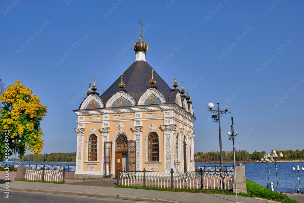 Scenic view of St. Nicholas Chapel in historical center of ancient touristic town Rybinsk in Yaroslavl oblast in Russian Federation. Beautiful summer sunny look of old temple