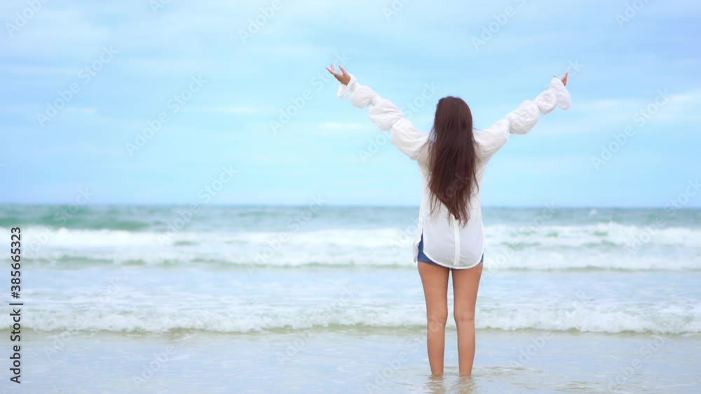 Free feminist asian girl enjoying freedom at beach Free feminist asian girl enjoying freedom at beach