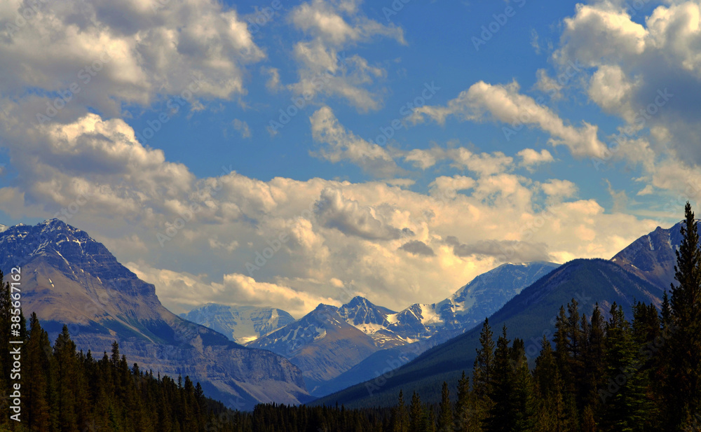 Alberta, Canada - Clouds drifting over the Rockies by Highway 93