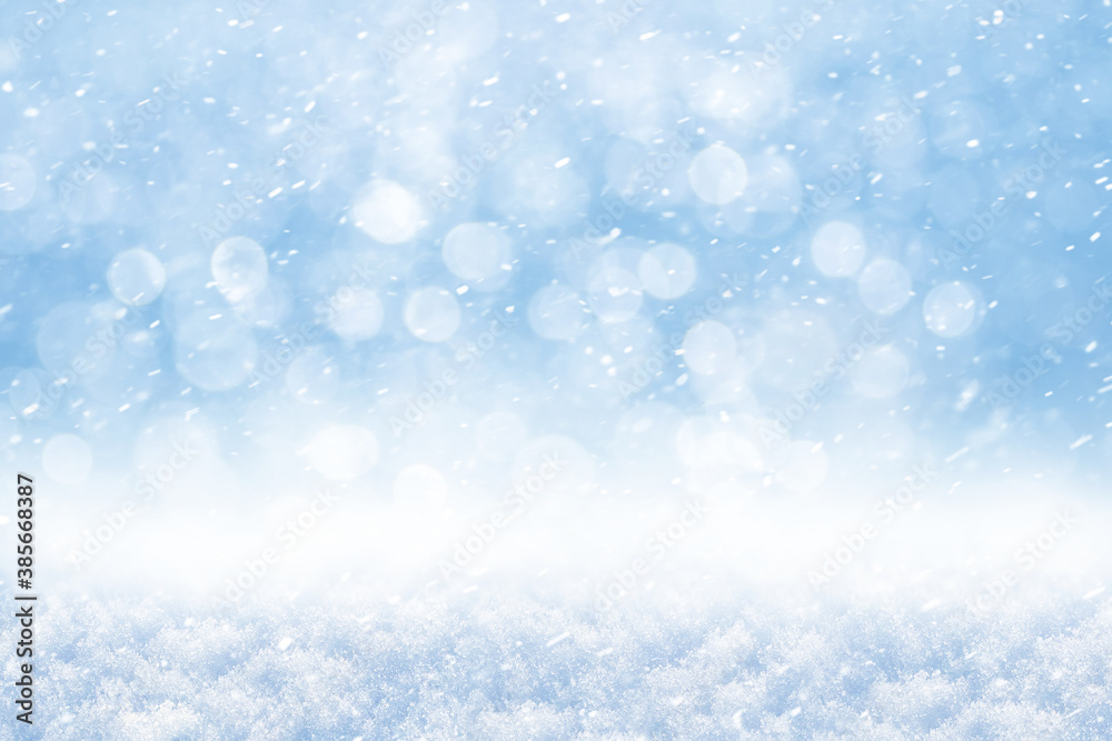 Winter abstract background with snow and blurred background with bokeh