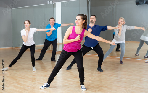 Dance class for adult people, positive young and mature men and women training in dance studio