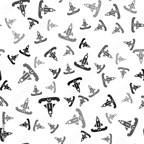 Black Rocket icon isolated seamless pattern on white background. Vector.