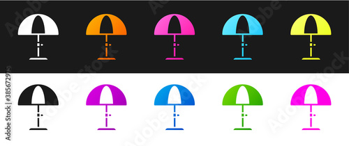 Set Sun protective umbrella for beach icon isolated on black and white background. Large parasol for outdoor space. Beach umbrella. Vector.