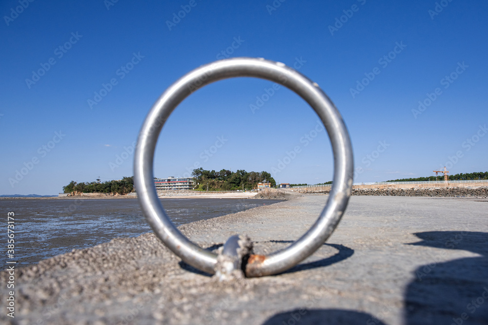 the landscape of seashore through the rounding ring.